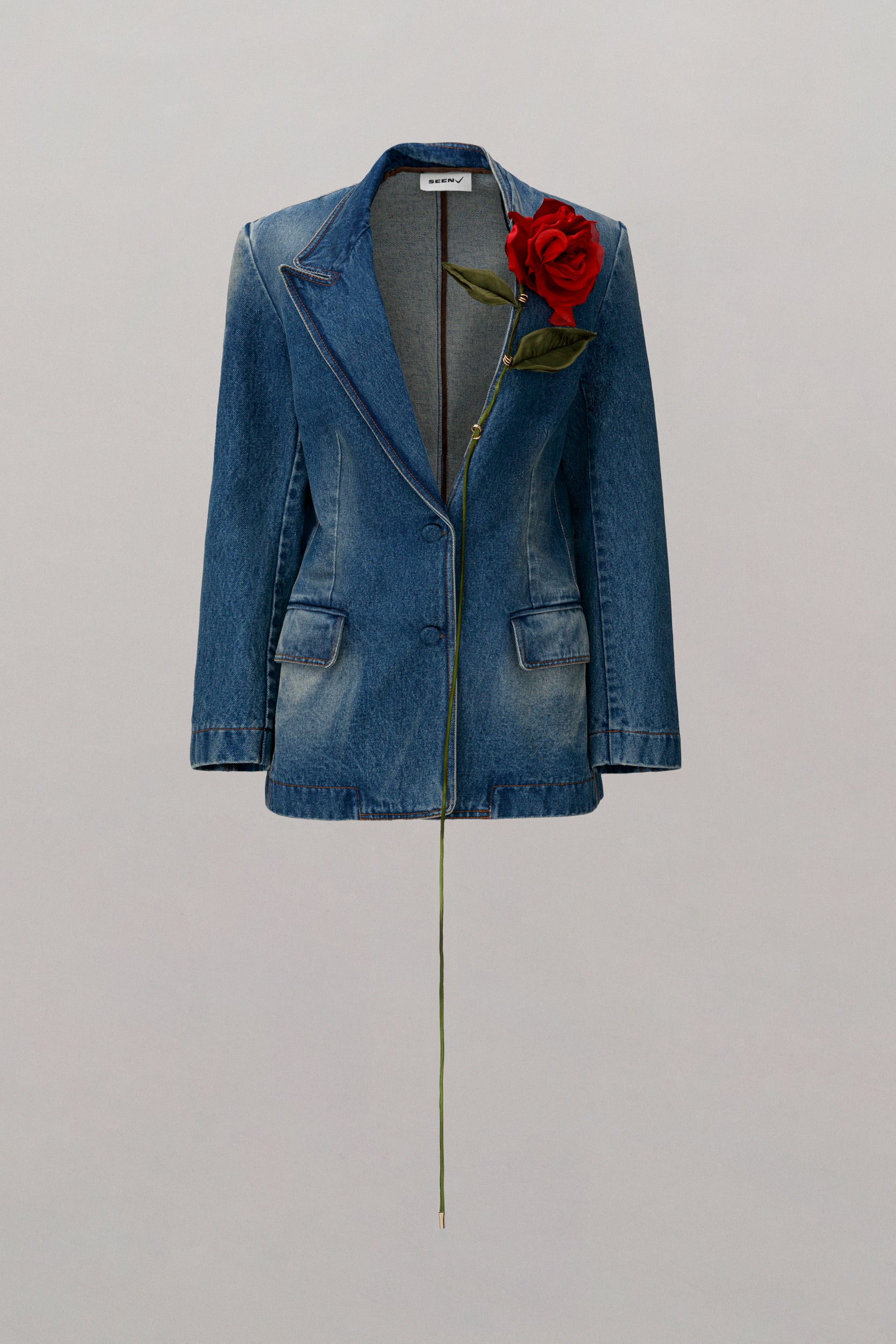 Blue blazer, with bright red outlet and blue roses